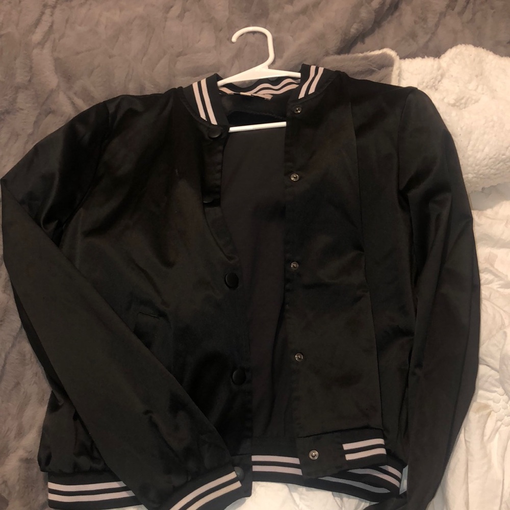 Cute jacket! Fits more like a medium